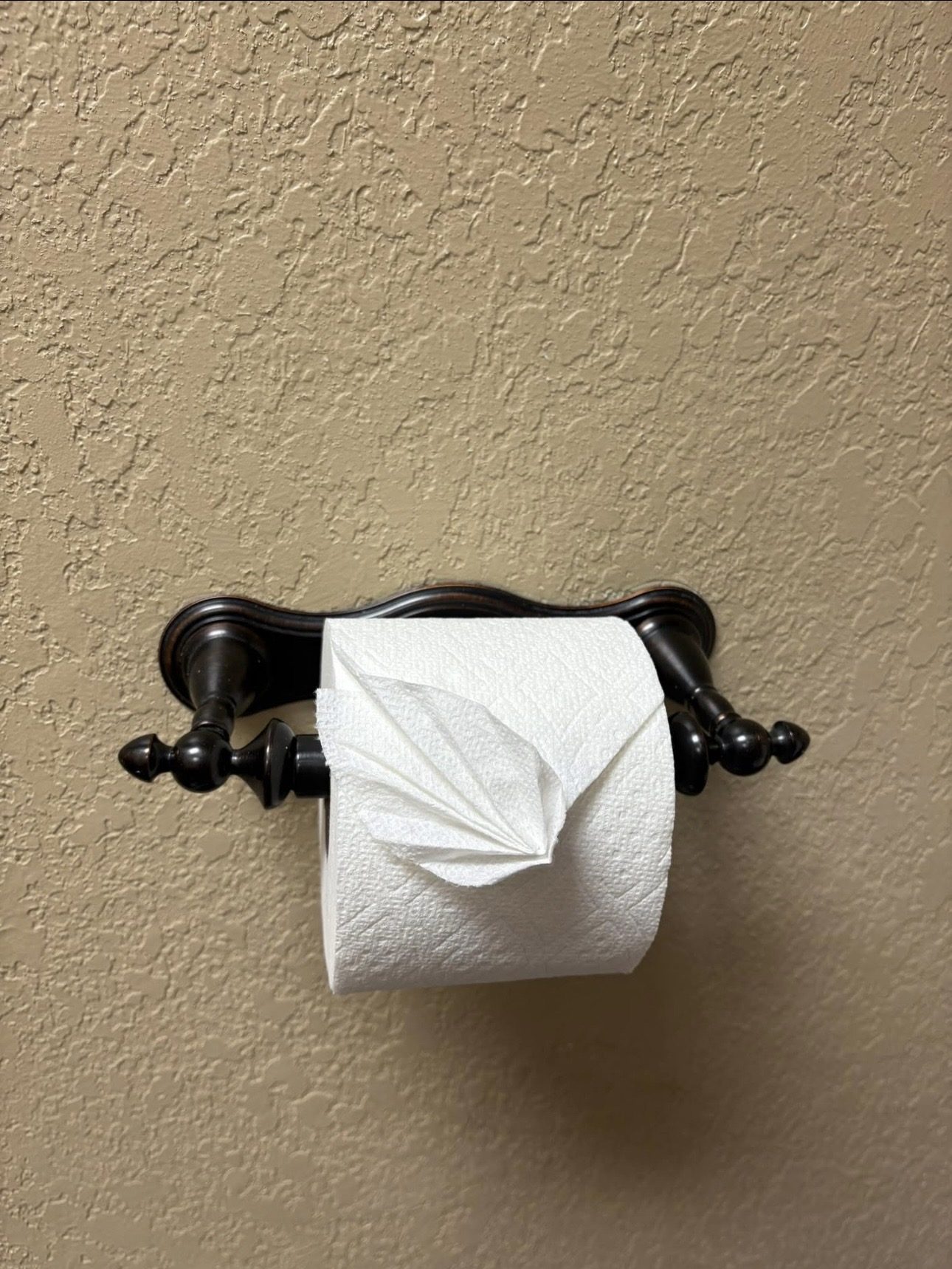 Toilet paper folded into a leaf