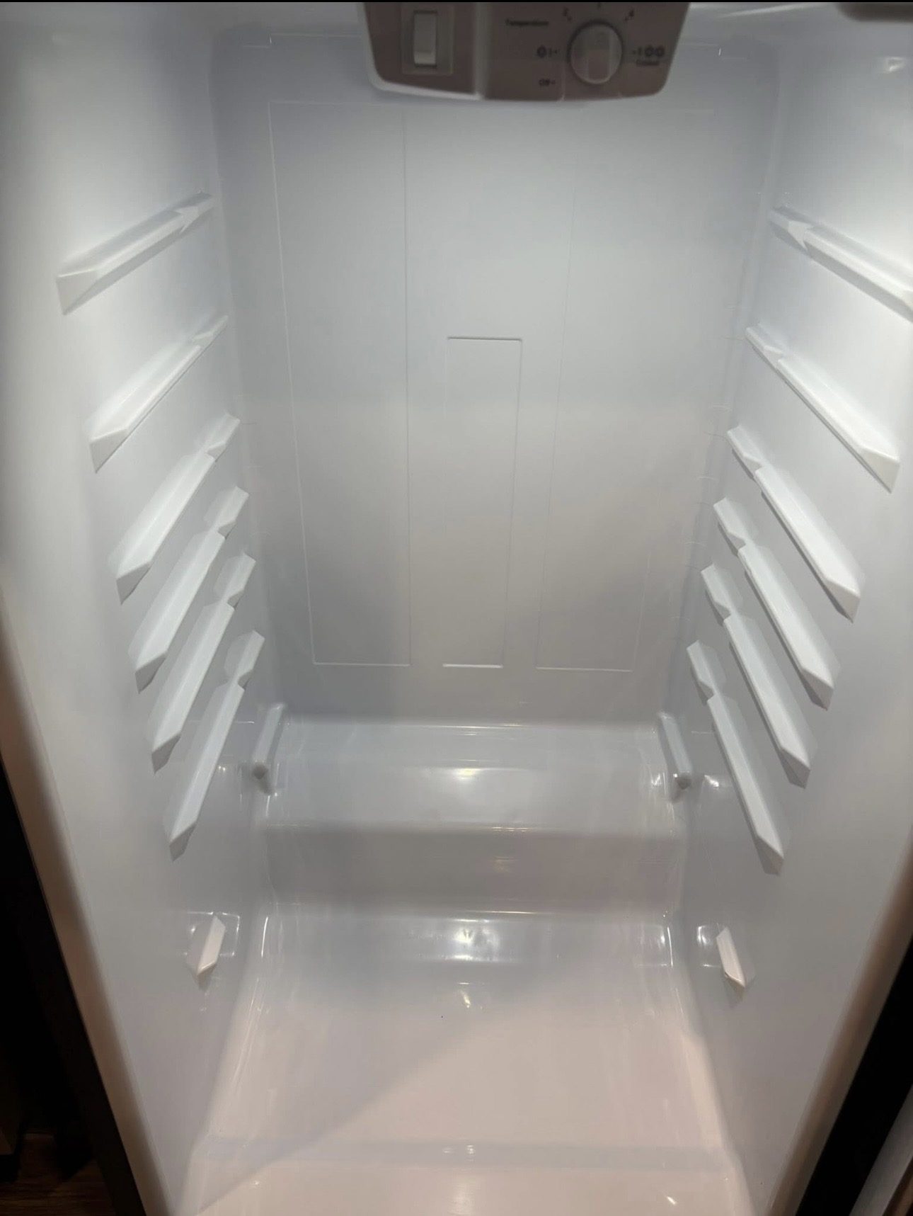 Refrigerator interior after cleaning, completely spotless