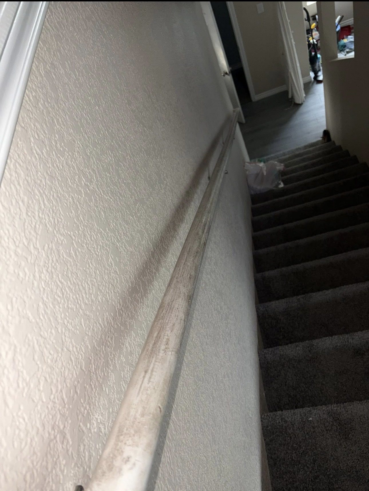 Stair handrail before cleaning